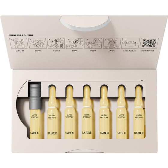 Babor Nutri Restore Ampoule 14 ml närande nutriampull i sju gula glasampuller i en öppen vit box med instruktioner