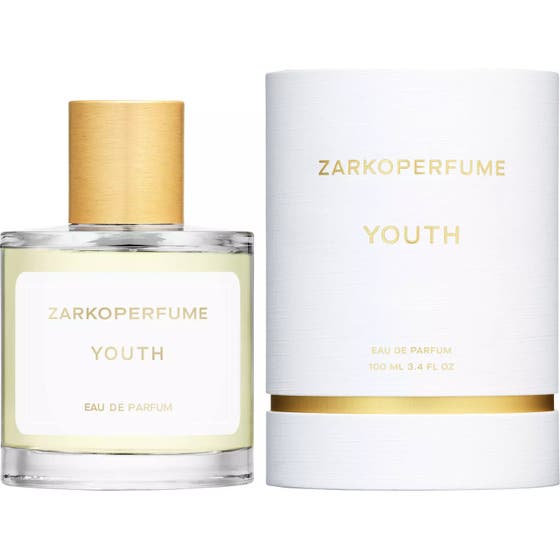Zarkoperfume Youth Eau de Parfum 100 ml fruktig designer parfym i genomskinlig glasflaska med vit etikett och gulddetaljer