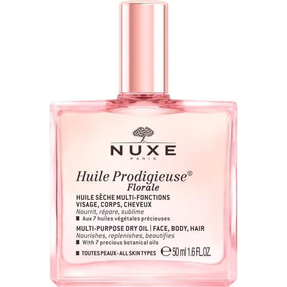 Nuxe Huile Prodigieuse Florale 50 ml torrolja som ger näring i en rosa glasflaska med glänsande roséguldfärgad kork