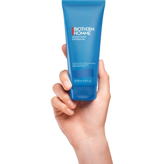 Biotherm Homme duschgel Aquafitness 200 ml uppfriskande 2-i-1 duschgel i ny turkos design bredvid den gamla tuben.