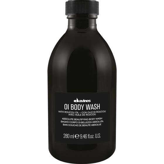 Davines OI Body Wash 280 ml duschkräm med olja för torr hud i mörk flaska med roucouolja.