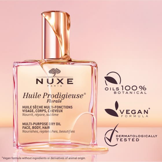 Nuxe Huile Prodigieuse Dry Floral 50 ml närande kroppsolja i vinklad glasflaska med rosa kork på rosa bakgrund
