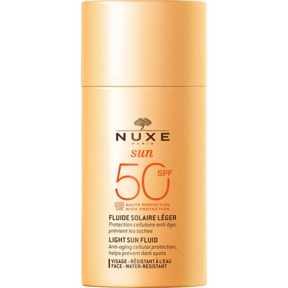 Nuxe Sun Light Sun Fluid SPF 50 50ml solskydd som ger anti-age skydd i en persikofärgad flaska med matchande lock