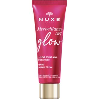 Nuxe Merveillance Lift Glow uppstramande kräm ansikte ger lyster i en hallonrosa tub med guldfärgat lock