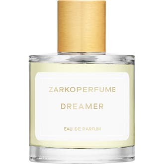 Zarkoperfume Dreamer 100 ml parfym i en elegant cylinderformad glasflaska med glänsande guldkork och ljusgul vätska