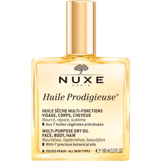Nuxe Huile Prodigieuse 100 ml dry oil ger näring i en fyrkantig glasflaska med glansig guldkork.