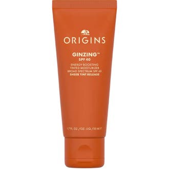 Origins GinZing SPF 40 50 ml solkräm ansikte med färg i en klarorange tub som ger huden lyster.